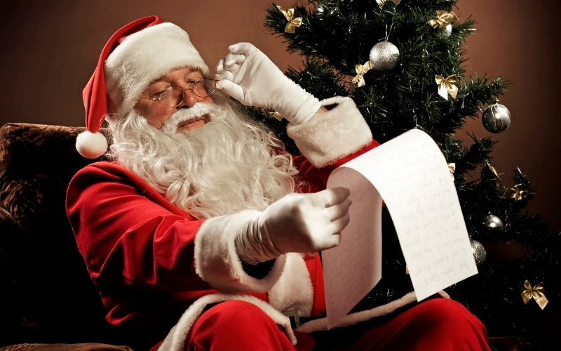 Santa Claus eyes his list during Christmas